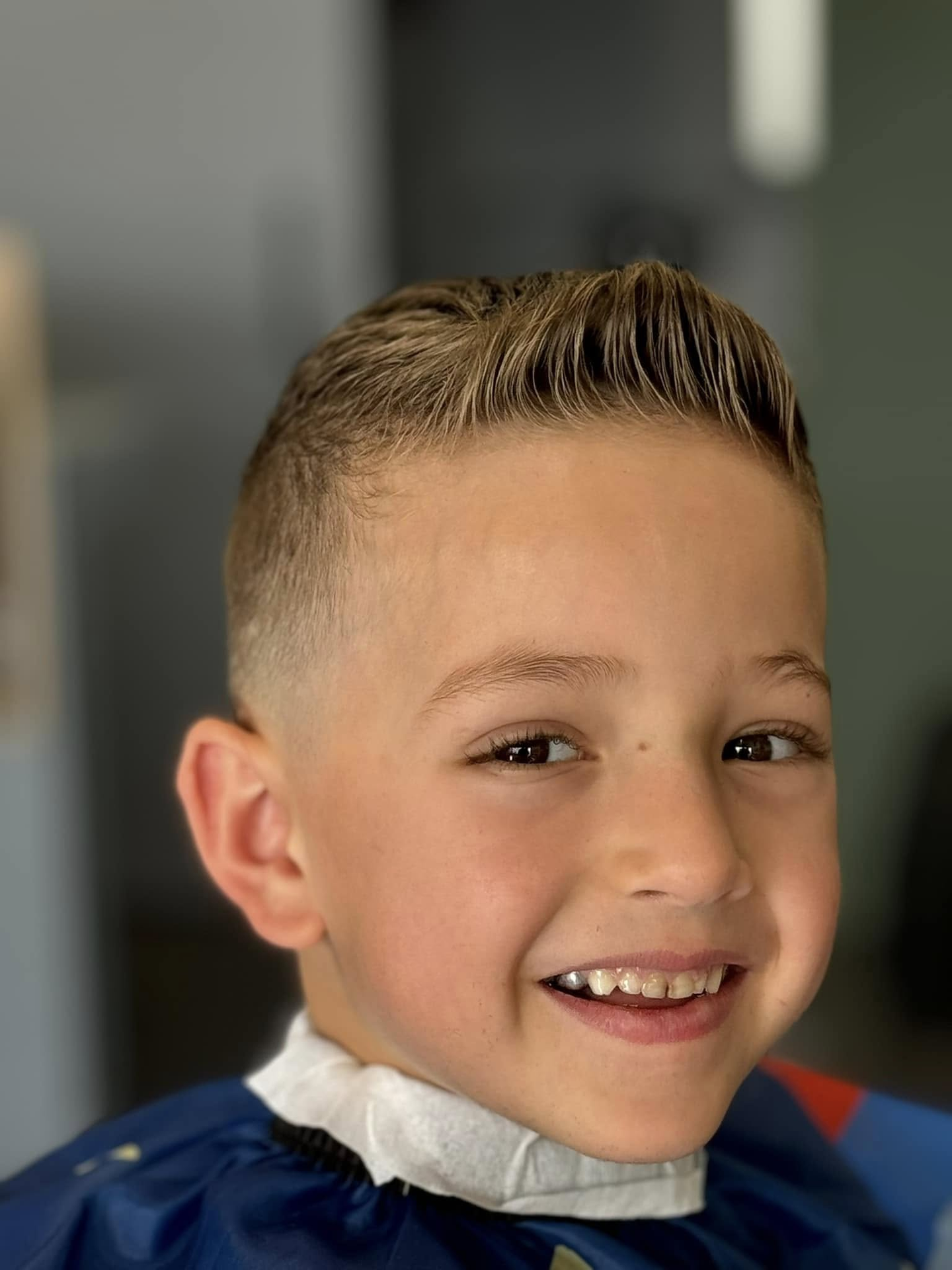 Smiling young client with a fresh fade
