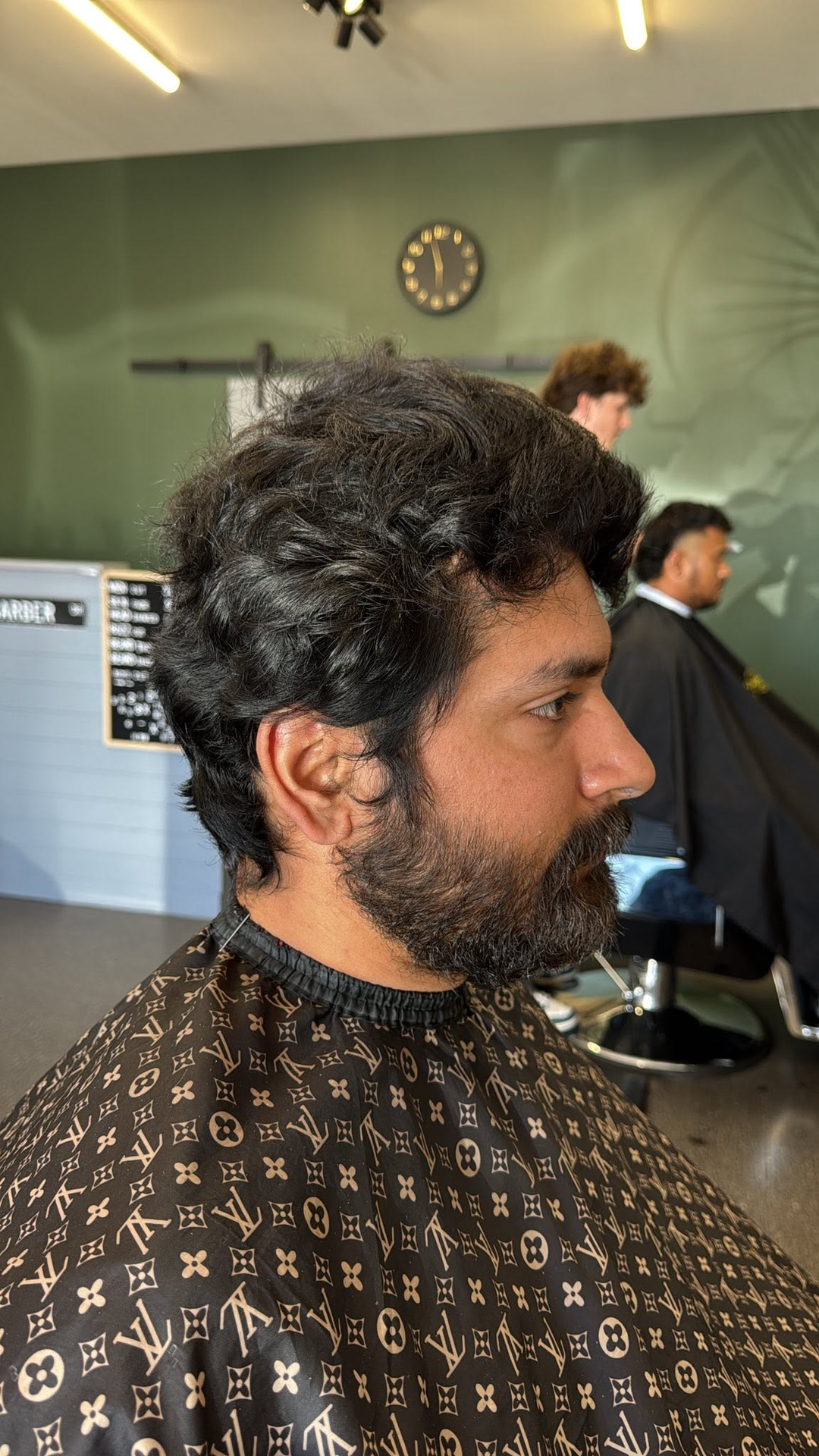 Barber mid-cut on a client at WG Brothers Barber